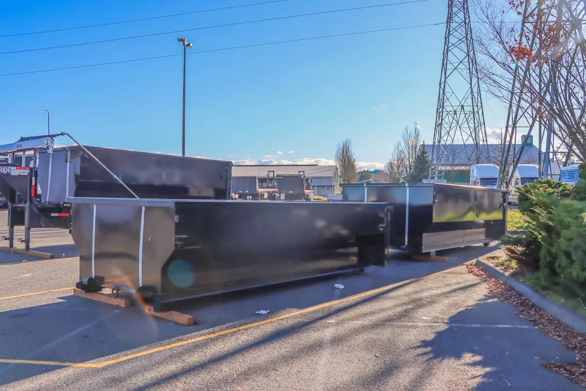 Roll-off dumpster ready for waste disposal at job site for 12 Yard Dumpster Rental in Bettendorf